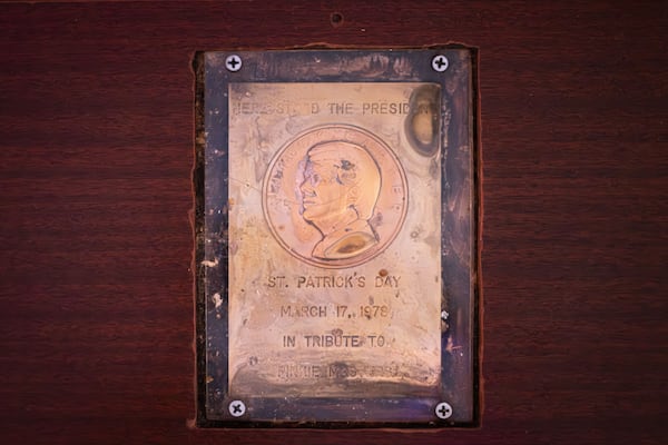 A plaque commemorating where Jimmy Carter stood is embedded into the counter of Pinkie Masters bar in Savannah, GA on December 23, 2024. In March of 1978, Carter stood on the location of the plaque and gave a eulogy to the bars former owner. (Justin Taylor/The Atlanta Journal Constitution)