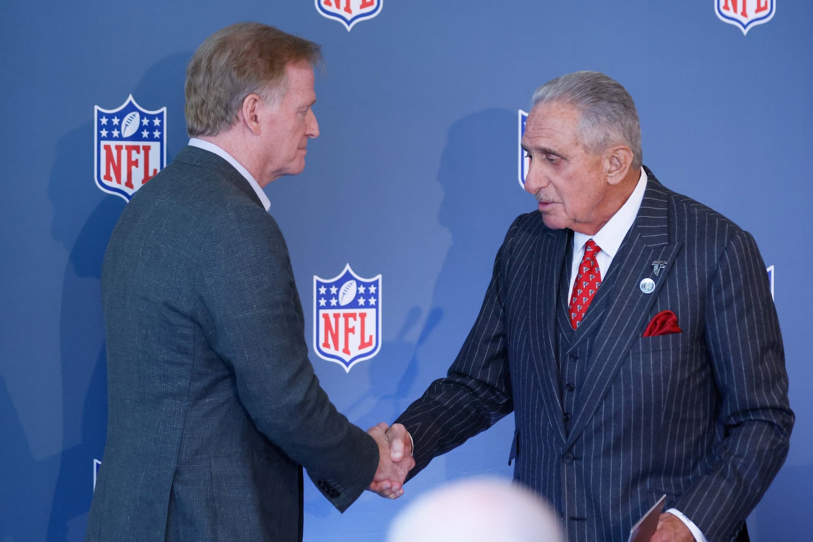 Falcons owner Arthur Blank (right) shakes hands with NFL Commissioner Roger Goodell after announcing that Atlanta will host Super Bowl LXII in 2028.