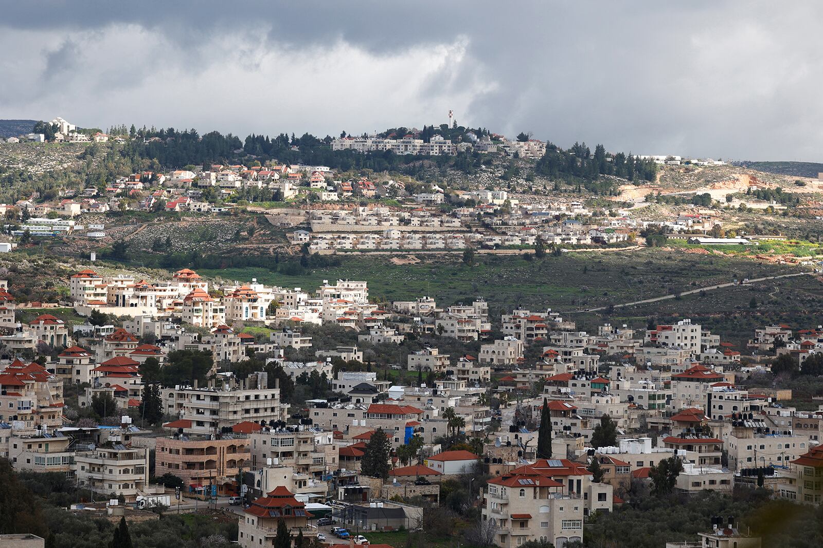 A picture taken in the village of Turmus Ayya near Ramallah shows the nearby Israeli Shilo settlement in the background, in the occupied West Bank on Feb. 18. (Jaafar Ashtiyeh/AFP via Getty Images/TNS)