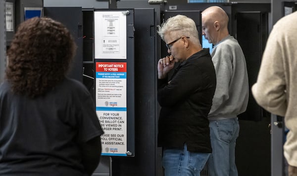 Michelle Kiepper (center) voted at the Joan P. Garner Library in Atlanta last week.