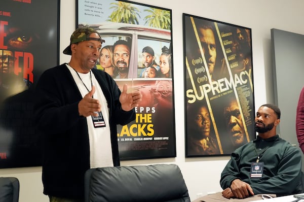 Filmmaker and former professional basketball player Deon Taylor, left, discusses the movie industry with Las Vegas Raiders linebacker K'Lavon Chaisson during a filmmaking workshop for NFL players on Tuesday, March 4, 2025, in Santa Monica, Calif. (AP Photo/Chris Pizzello)