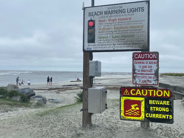 A beach warning sign flashes red on St. Simons Island on Georgia's coast on Tuesday, Aug. 6, 2024.