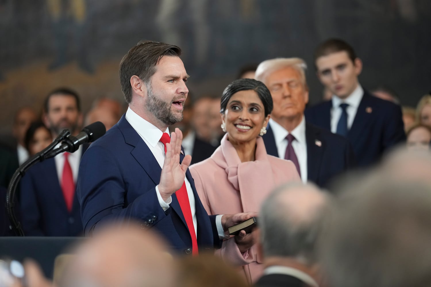 
                        JD Vance, standing with his wife, Usha, is sworn in as vice president by Supreme Court Associate Justice Brett Kavanaugh during the inauguration of Donald Trump as the 47th president in the Rotunda at the Capitol in Washington on Monday morning, Jan. 20, 2025. (Doug Mills/The New York Times)
                      