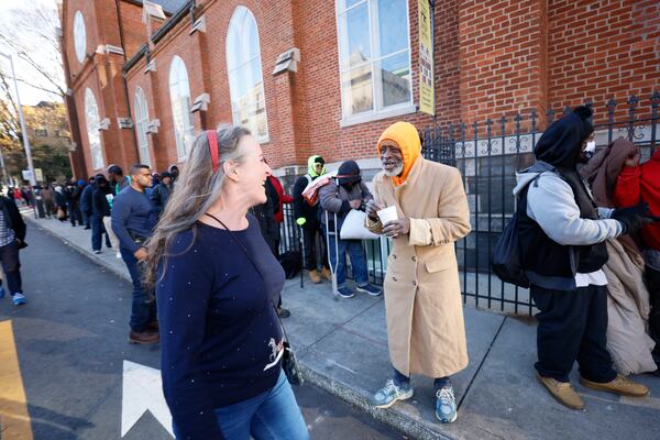 Outreach Coordinator Tilla Jones greets someone as people wait in line for the morning sandwich and snack ministry program at the Catholic Shrine of the Immaculate Conception on Thursday, Dec. 14, 2023.
Miguel Martinez /miguel.martinezjimenez@ajc.com