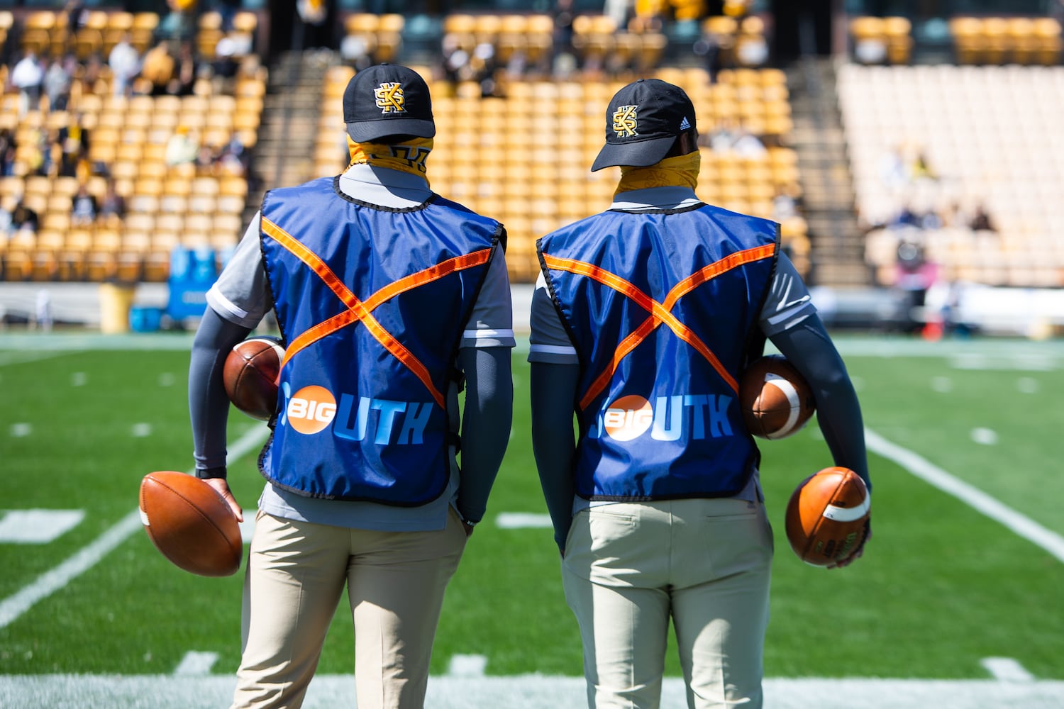 Two ball handlers stand on the sidelines during the game. CHRISTINA MATACOTTA FOR THE ATLANTA JOURNAL-CONSTITUTION.