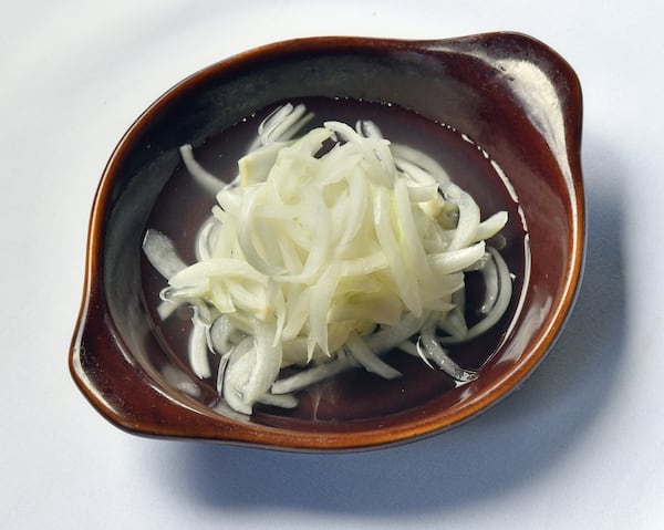 Pickled Vidalia Onions are part of the Arnette’s Chop Shop Iceberg Wedge Salad. (Styling by chef Stephen Herman / Chris Hunt for the AJC)