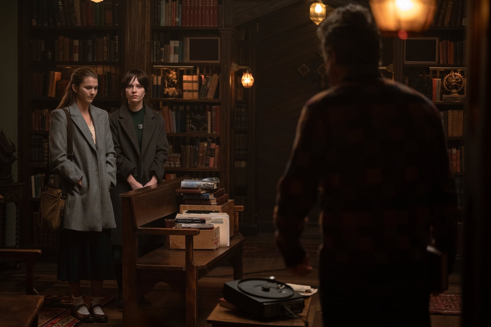 This image released by A24 shows, from left, Chloe East, Sophie Thatcher, and Hugh Grant in a scene from "Heretic." (Kimberley French/A24 via AP)