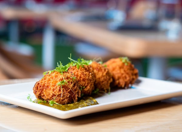 Pimento cheese hush puppies at Molly B’s can be hard to resist. CONTRIBUTED BY HENRI HOLLIS