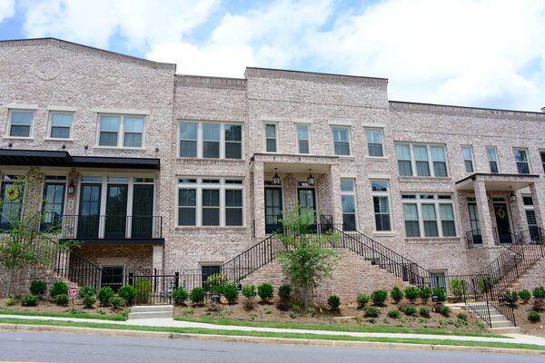 The three-story, 2,243-square-foot townhouse is in Sandy Springs' Prescott Walk neighborhood, a 36-home community built by Ashton Woods in 2017. Dalusky was drawn to its brownstone-style design with modern elements, such as the flat roof.