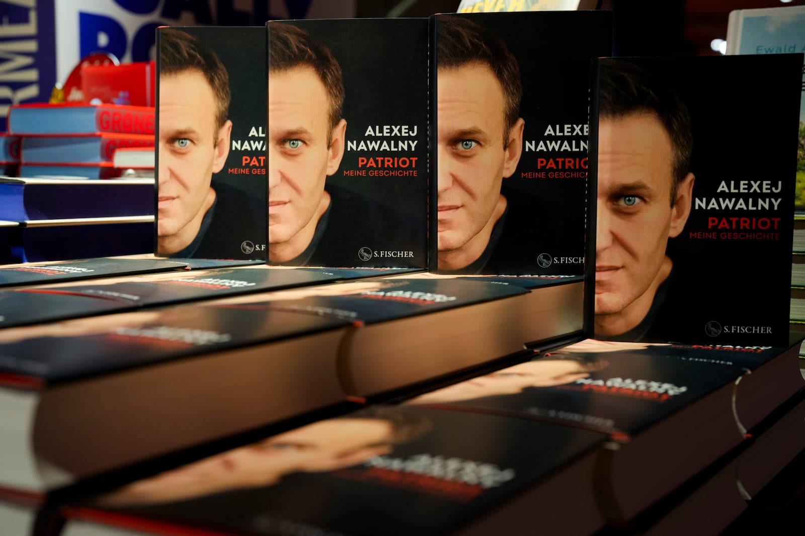 Copies of the late Russian opposition leader Alexei Navalny's memoir entitled 'Patriot' are put display on the first day of sale in a bookshop in Berlin, Germany, Tuesday, Oct. 22, 2024. (AP Photo/Markus Schreiber)