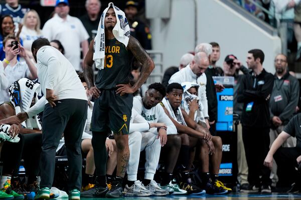 Baylor guard Langston Love (13) watches as the time on the game clock winds down and reacts to his team's loss to Duke in the second round of the NCAA college basketball tournament, Sunday, March 23, 2025, in Raleigh, N.C. (AP Photo/Stephanie Scarbrough)