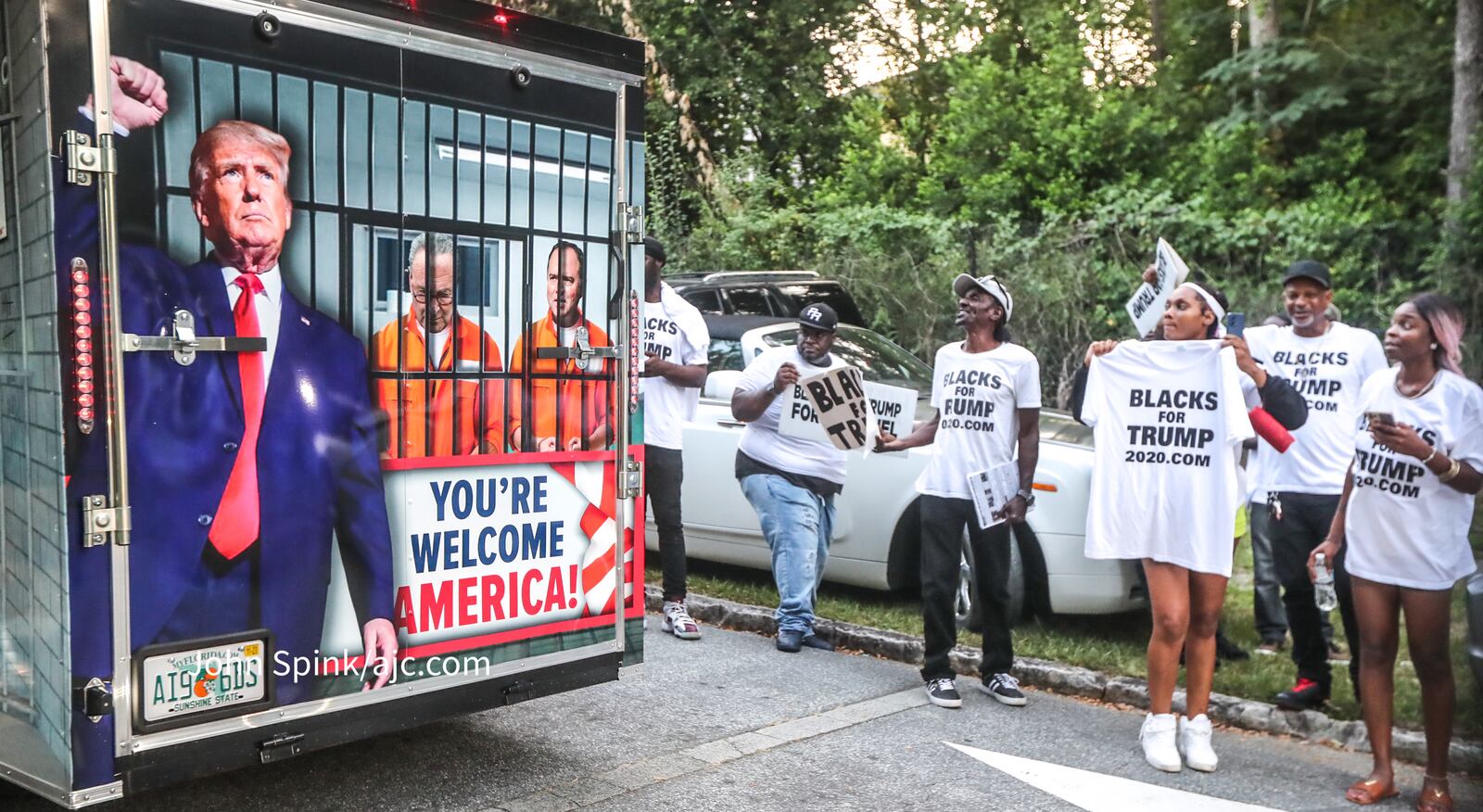 Groups of Trump supporters wait outside the Fulton County Jail on Thursday ahead of the former president's surrender. (John Spink / John.Spink@ajc.com )