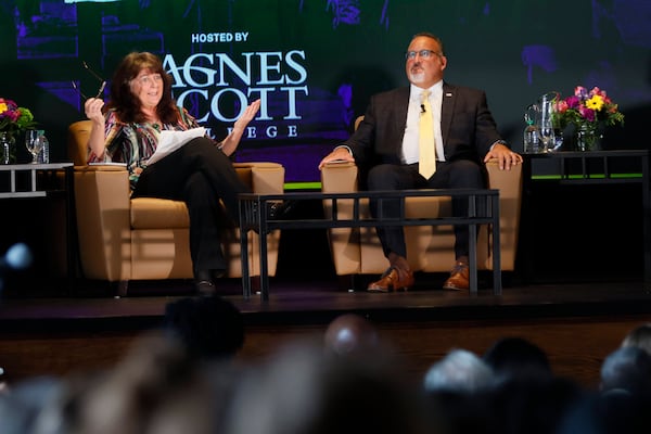 Maureen Downey, AJC education columnist, seen here with U.S. Secretary of Education Miguel Cardona, is a guest today on the "Politically Georgia" show.