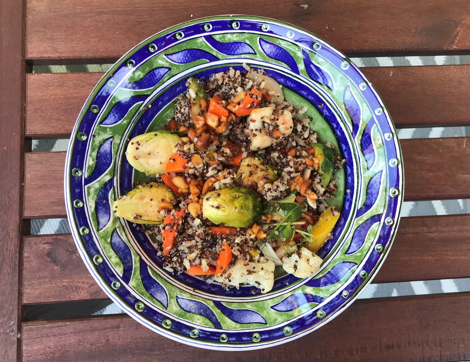 An order of Mission and Market’s warm quinoa and brown rice with peanut agrodolce and spring vegetables is a hearty, healthy portion. It travels well, and leftovers are reheated easily. LIGAYA FIGUERAS / LIGAYA.FIGUERAS@AJC.COM