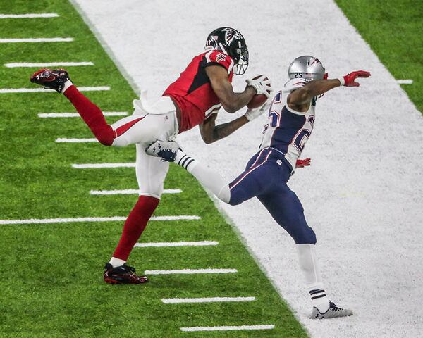 Julio Jones gets his first foot down as he makes an impressive catch over Patriots defender Eric Rowe  during Super Bowl LI Feb. 5, 2017, at NRG Stadium in Houston.