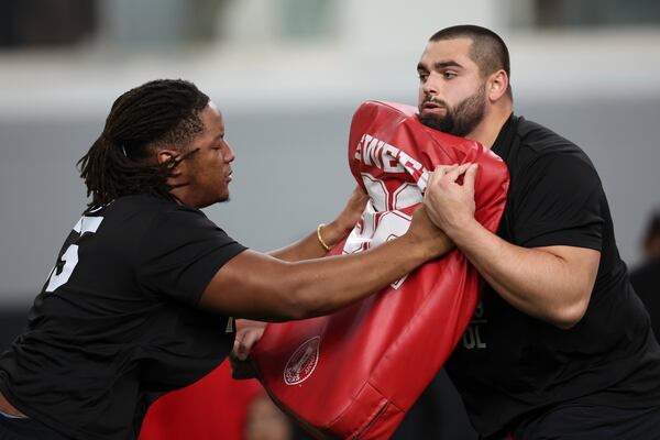 Georgia's Jared Wilson, left, runs a drill with Dylan Fairchild, right, during the school's NFL Pro Day, Wednesday, March, 12, 2025, in Athens, Ga. (AP Photo/Colin Hubbard)