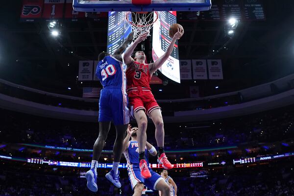 Chicago Bulls' Josh Giddey (3) goes up for a shot against Philadelphia 76ers' Adem Bona (30) during the first half of an NBA basketball game Monday, Feb. 24, 2025, in Philadelphia. (AP Photo/Matt Slocum)