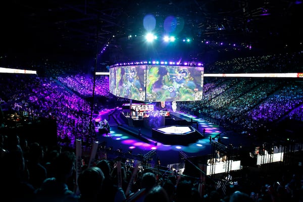 A general view during the final of League of Legends tournament between Team G2 Esports and Team FunPlus Phoenix, in Paris, Sunday, Nov. 10, 2019. The biggest e-sports event of the year saw a Chinese team, FunPlus Phoenix, crowned as world champions of the video game League of Legends. Thousands of fans packed a Paris arena for the event, which marked another step forward for the growing esports business. (AP Photo/Thibault Camus)