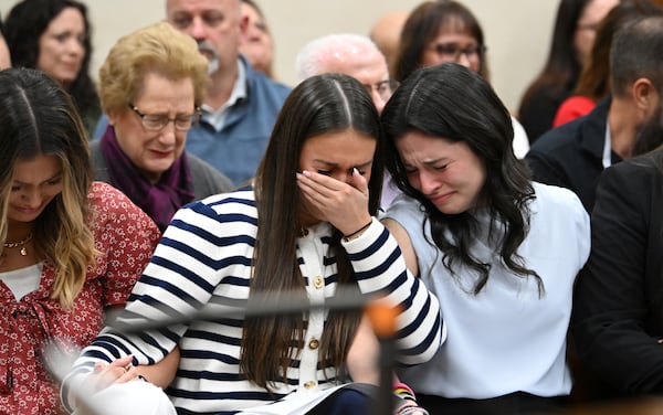 From left, Connolly Huth, roommate of Laken Riley, Lauren Phillips, sister of Laken Riley, and Sofia Magana, roommate of Laken Riley, react as Superior Court Judge H. Patrick Haggard announces the verdict during a trial of Jose Ibarra at Athens-Clarke County Superior Court, Wednesday, Nov. 20, 2024, in Athens, Ga. (Hyosub Shin/Atlanta Journal-Constitution via AP, Pool)