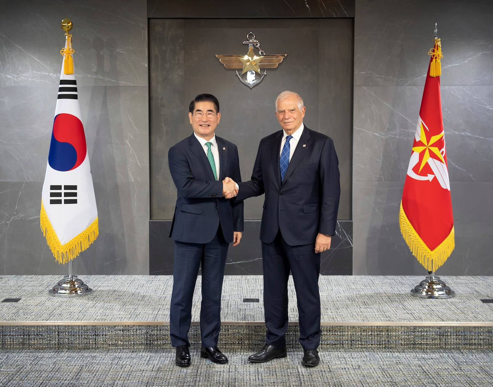 In this photo provided by South Korea Defense Ministry, South Korean Defense Minister Kim Yong Hyun, left, and European Union foreign policy chief Josep Borrell, right, pose for a photo at the Defense Ministry, in Seoul, South Korea, Monday, Nov. 4, 2024. (South Korea Defense Ministry via AP)