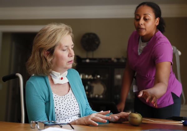 Roswell resident Jule Hamrick gets in-home physical therapy in August 2019 from Martresha Wood. She was partially paralyzed from a West Nile virus infection. Only recently was she strong enough to disconnect from a ventilator, but she remains confined to a wheelchair most of her waking hours. West Nile Virus is the leading mosquito-borne disease in the continental U.S., and it is again present in metro Atlanta mosquitoes this year. Bob Andres / robert.andres@ajc.com