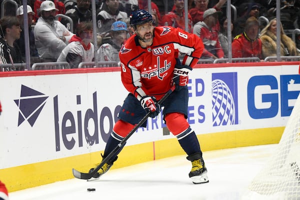 Washington Capitals left wing Alex Ovechkin (8) skates with the puck during the first period of an NHL hockey game against the Montreal Canadiens, Thursday, Oct. 31, 2024, in Washington. (AP Photo/Nick Wass)