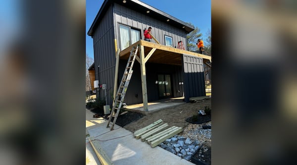 Workers are rebuilding Tanya Wright's deck. The homeowner says her leg fell through the deck flooring. Courtesy Tanya Wright.