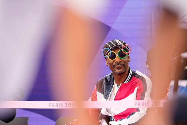 FILE - American artist Snoop Dogg sits in the audience prior to the breaking competition at La Concorde Urban Park at the 2024 Summer Olympics, Friday, Aug. 9, 2024, in Paris, France. (AP Photo/Frank Franklin, File)