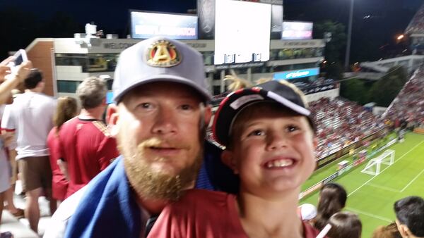 Atlanta Untied fan Josh Proctor and son Jaydon at an Atlanta United match at Bobby Dodd Stadium. (Photo courtesy of Josh Proctor)