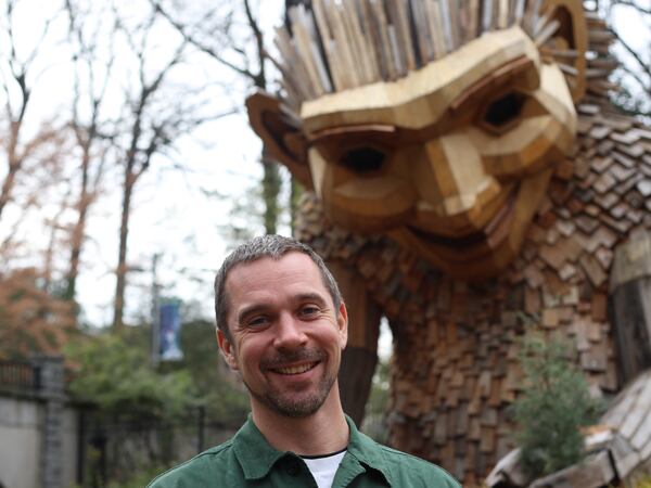 Danish artist Thomas Dambo created a giant troll named Rosa Sunfinger, who has converted a European smart car into an enormous planter at Atlanta Botanical Garden. / Courtesy of Atlanta Botanical Garden