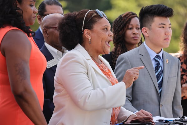 Gwinnett District Attorney Patsy Austin-Gatson (center) speaks during a press conference held by Peachtree Ridge High School student Tyler Lee addressing gun violence at the Gwinnett Justice and Administration Center in Lawrenceville on Friday, June 2, 2023.  (Natrice Miller/natrice.miller@ajc.com)