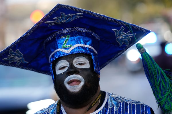 A parade participant gets ready before the start of the Krewe of Zulu parade on Mardi Gras Day, Tuesday, March 4, 2025 in New Orleans. (AP Photo/Gerald Herbert)