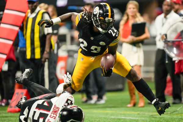 Pittsburgh Steelers running back Najee Harris runs over Atlanta Falcons linebacker Mike Jones Jr. during the first half of a preseason NFL football game Thursday, Aug. 24, 2023, in Atlanta. (AP Photo/Gerald Herbert)