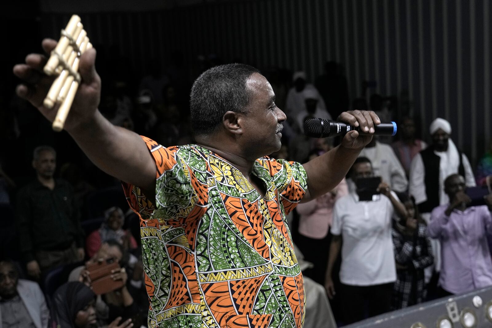 Sudanese Camirata troupe founder Dafallah el-Hag holds his traditional handmade "Agamo", during a show at the Russian culture center in Cairo, Egypt, Sunday, Sept. 15, 2024. (AP Photo/Amr Nabil)