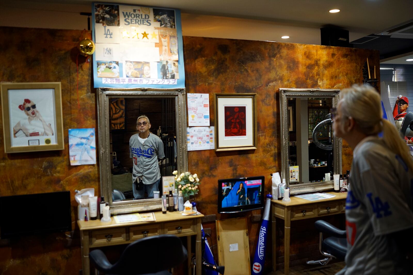 Hironobu Kanno, representative of a private fan club of Shohei Ohtani of the Los Angeles Dodgers, speaks at his beauty salon in Oshu, northeastern Japan, the hometown of Ohtani, Tuesday, Oct. 29, 2024. (AP Photo/Eugene Hoshiko)