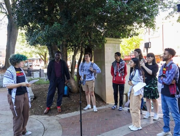 Members of the Students for Socialism hold a conference at The Arch in Athens, Georgia on Tuesday, Nov. 12, 2024. Supporters come together with the intention of speaking up against UGA’s potential ban for their solidarity with Palestine. (Photo Courtesy of Hosanna Worku)