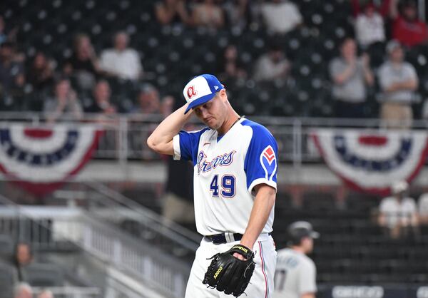 Braves reliever Nate Jones (49) walks off the mound in the eighth inning Monday, April 12, 2021, at Truist Park in Atlanta. (Hyosub Shin / Hyosub.Shin@ajc.com)