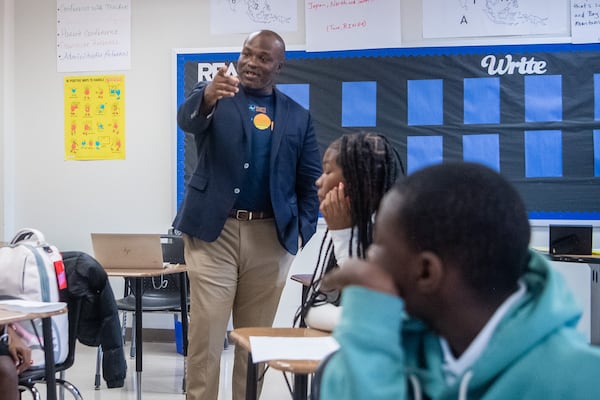 Superintendent Bryan Johnson, (left), interacts with students at the Sylvan Hills Middle School’s first day of class in Atlanta on Thursday, Aug. 1, 2024.  (Ziyu Julian Zhu / AJC)