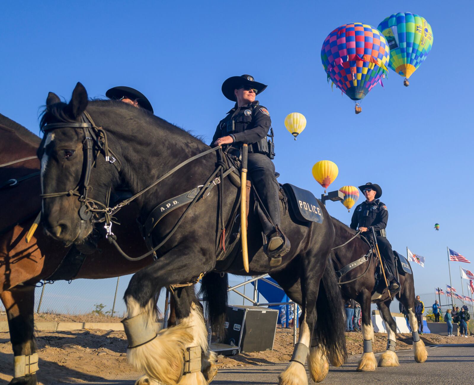 The Albuquerque Police Department's (APD) Horse Mounted Unit patrols during the 52nd Albuquerque International Balloon Fiesta in Albuquerque, N.M., on Saturday, Oct. 5, 2024. (AP Photo/Roberto E. Rosales)