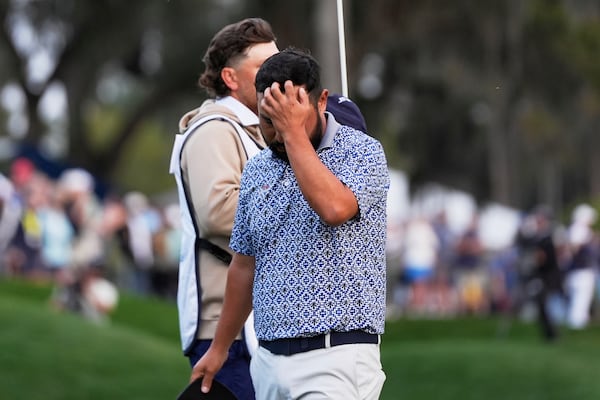 J.J. Spaun reacts after a putt on the 18th green during the final round of The Players Championship golf tournament Sunday, March 16, 2025, in Ponte Vedra Beach, Fla. (AP Photo/Julia Demaree Nikhinson)