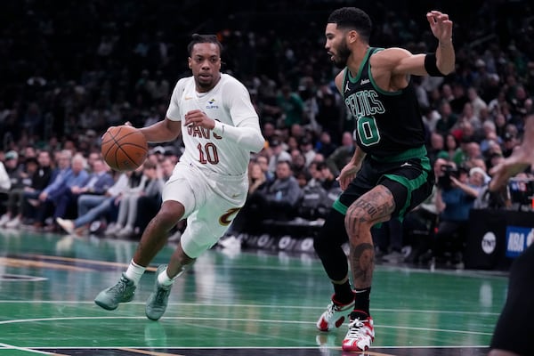 Cleveland Cavaliers guard Darius Garland (10) drives to the basket against Boston Celtics forward Jayson Tatum (0) during the first half of an Emirates NBA Cup basketball game, Tuesday, Nov. 19, 2024, in Boston. (AP Photo/Charles Krupa)