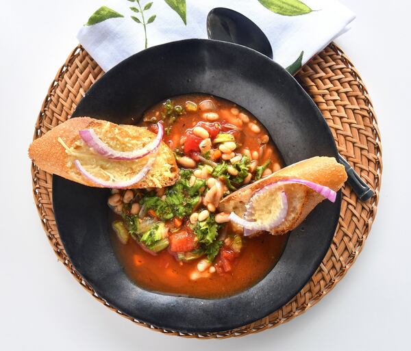 Easy Italian Ribollita, a variation on a Tuscan favorite, provides plenty of flavor, plus it’s a great excuse to enjoy slices of a fresh baguette. STYLING BY LISA HANSON / CONTRIBUTED BY CHRIS HUNT PHOTOGRAPHY