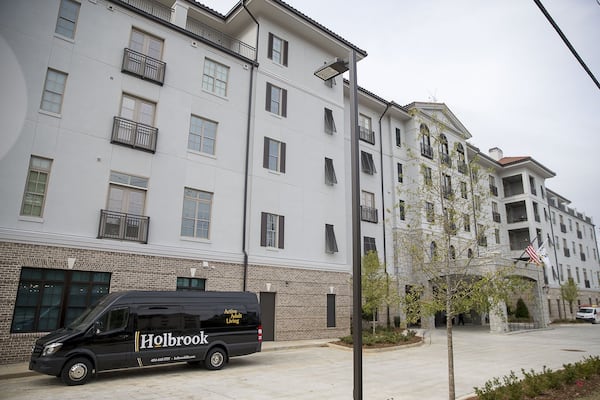 A shuttle sits outside the Holbrook of Decatur, an upscale senior living community. The complex offers residents free transportation to nearby locations. (Alyssa Pointer/Atlanta Journal Constitution)