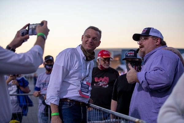 10/16/2020 -Macon, Georgia - U.S. Republican Senate candidate Doug Collins meets with supporters during a President Donald Trump rally at Middle Georgia Regional Airport in Macon, Friday, October 16, 2020.  (Alyssa Pointer / Alyssa.Pointer@ajc.com)