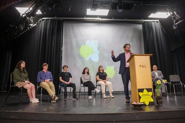 Rabbi Larry Sernovitz (center) talks to Pope High School students during the dedication of the Daffodil Project at Pope High School. Sernovitz said he believes the acts of antisemitism that have occurred in Cobb schools can likely be attributed to ignorance. (Jason Getz / Jason.Getz@ajc.com)
