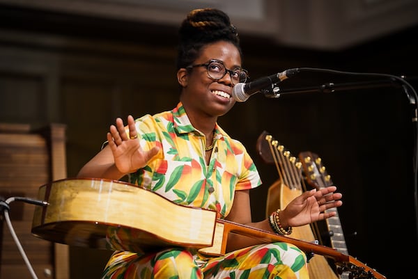 Yasmin Williams uses an unorthodox fingerstyle technique, playing her guitar flat in her lap, often with a kalimba on top of it. Photos: Big Ears