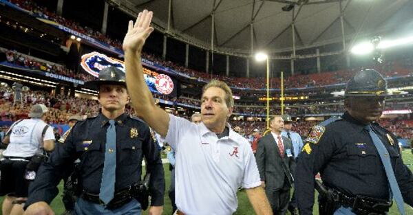 Alabama coach Nick Saban waves to fans after his team’s win over Florida in last year’s SEC Championship game at the Georgia Dome. The teams meet again Saturday for the title. (Credit: AJC file)