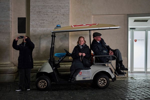 Catholic worshippers attend a nightly rosary prayer service for Pope Francis in St. Peter's Square at the Vatican, Thursday, March 6, 2025. (AP Photo/Francisco Seco)