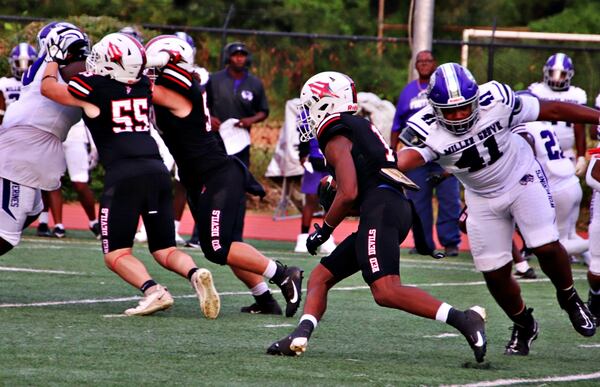 Druid Hills running back Zach Manning rushed for 210 yards, two touchdowns and a two-point conversion in a win over Miller Grove, Sept. 6, 2024.