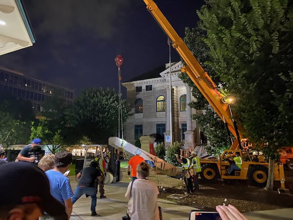 The Confederate obelisk erected by the Daughters of the Confederacy in 1908 was removed from Decatur Square the night of June 18, 2020. DeKalb County Superior Court Judge Clarence Seeliger ordered the monument removed by June 26, declaring it a public nuisance due to the protests and vandalism it attracted. A crowd of hundreds assembled to watch the removal. MANDATORY CREDIT: AMANDA COYNE / THE ATLANTA JOURNAL-CONSTITUTION